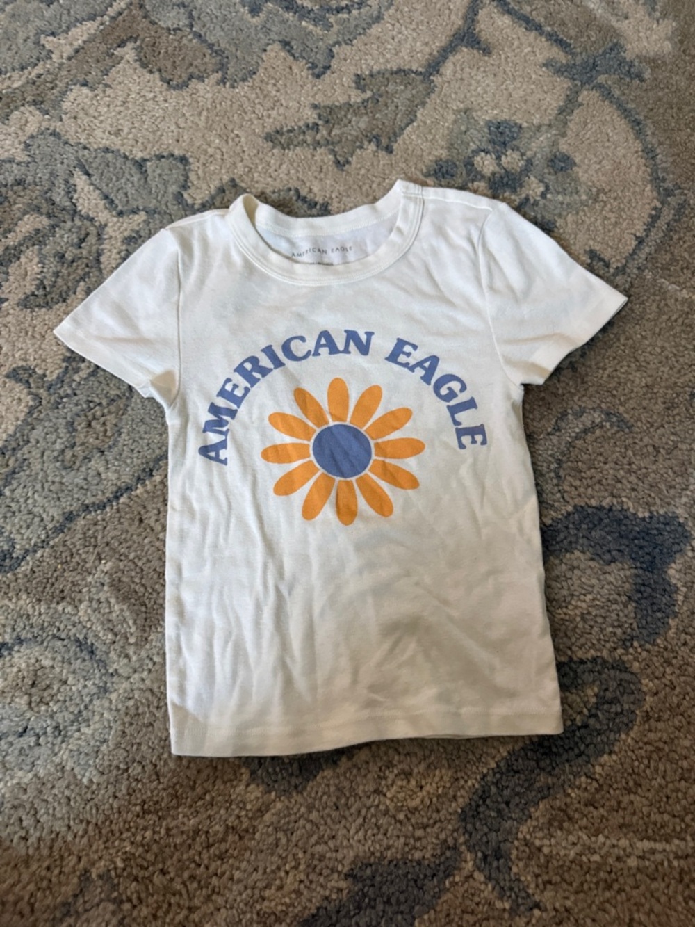 American Eagle Outfitters White Tee with Orange Daisy and Blue Logo